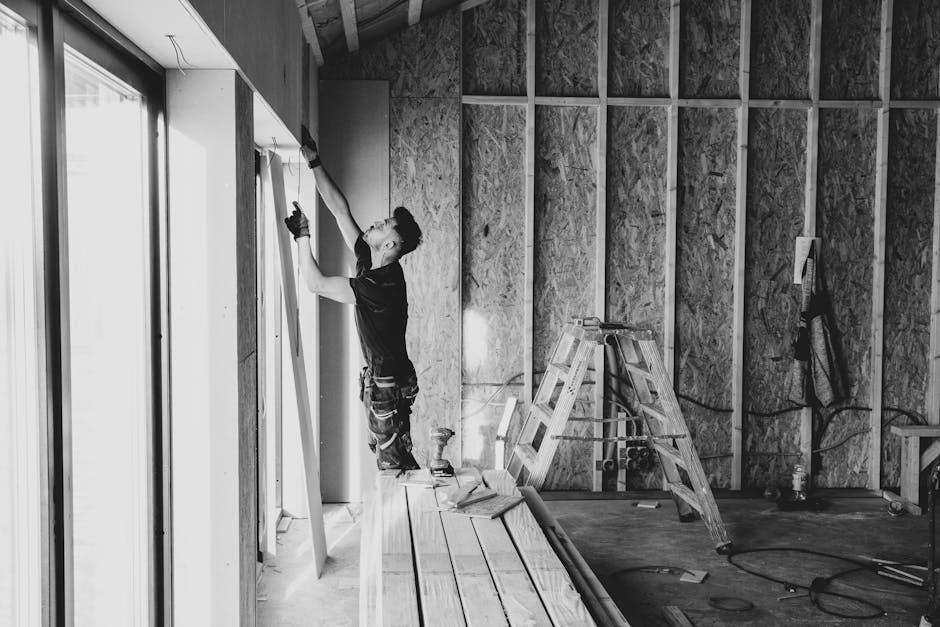 Contractor carefully installing a replacement window
